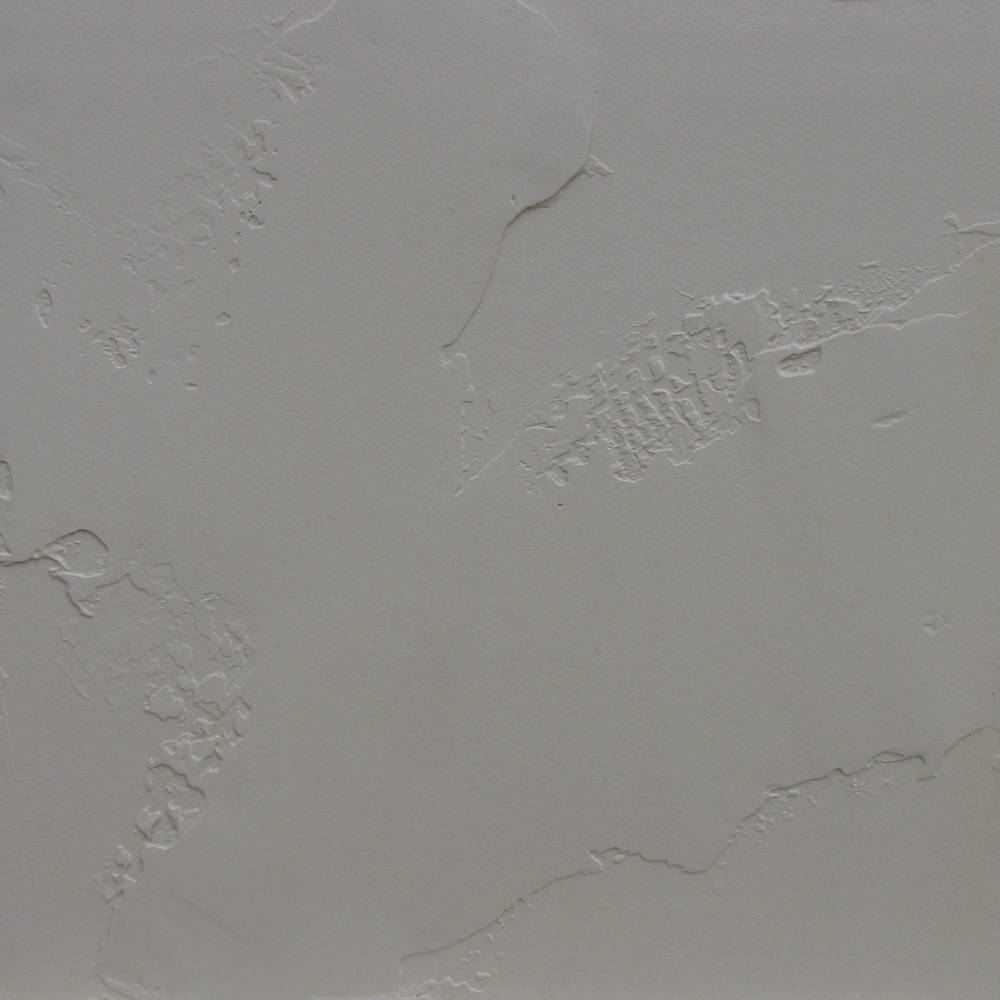 piece of wall with skip trowel, prime and paint done.