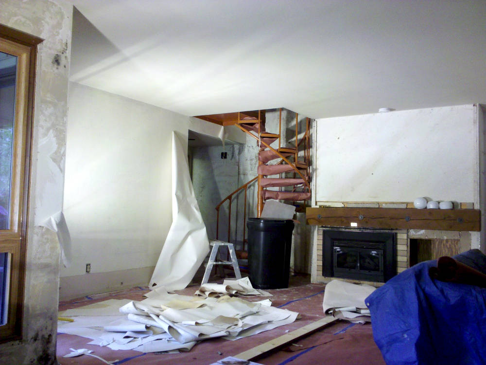 showing a condominium during wallpaper removal.