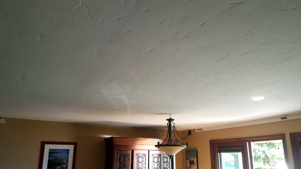 showing a concrete ceiling with a hand texture just painted.