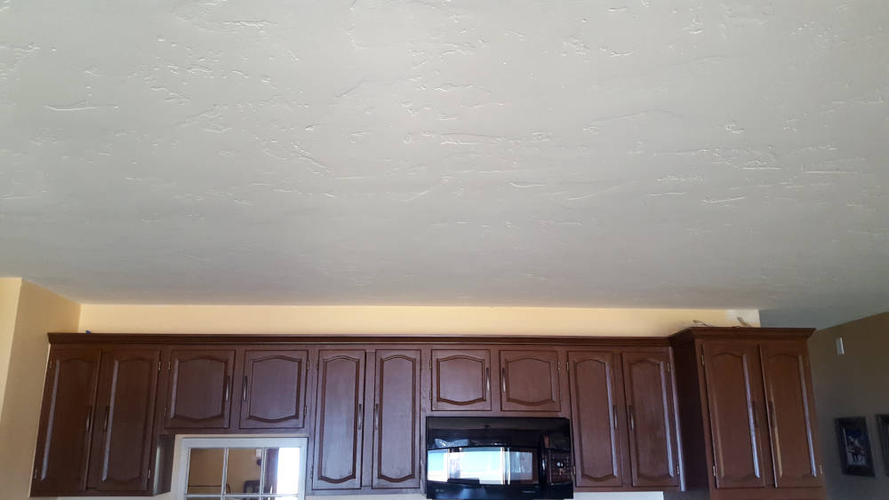 showing a kitchen ceiling area with a beautiful skip trowel texture.