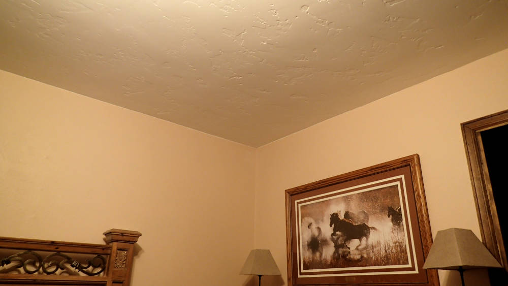 showing a bedroom with the walls and ceilings painted.