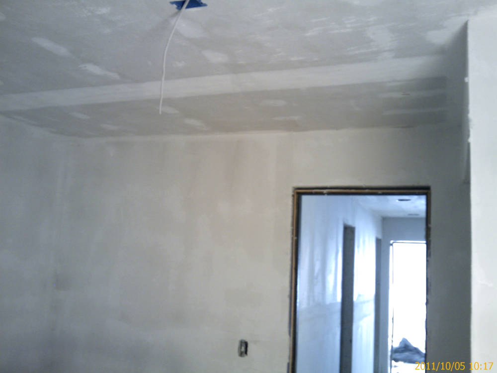 a remodel, acoustical ceiling removal and change 
					from knock down to skip trowel/hand texture.