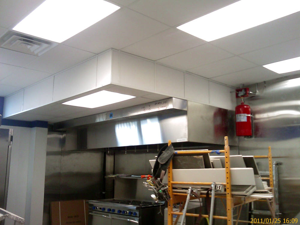 after a kitchen in a restaurant showing
the acoustical ceiling after the acoustical tiles have been installed