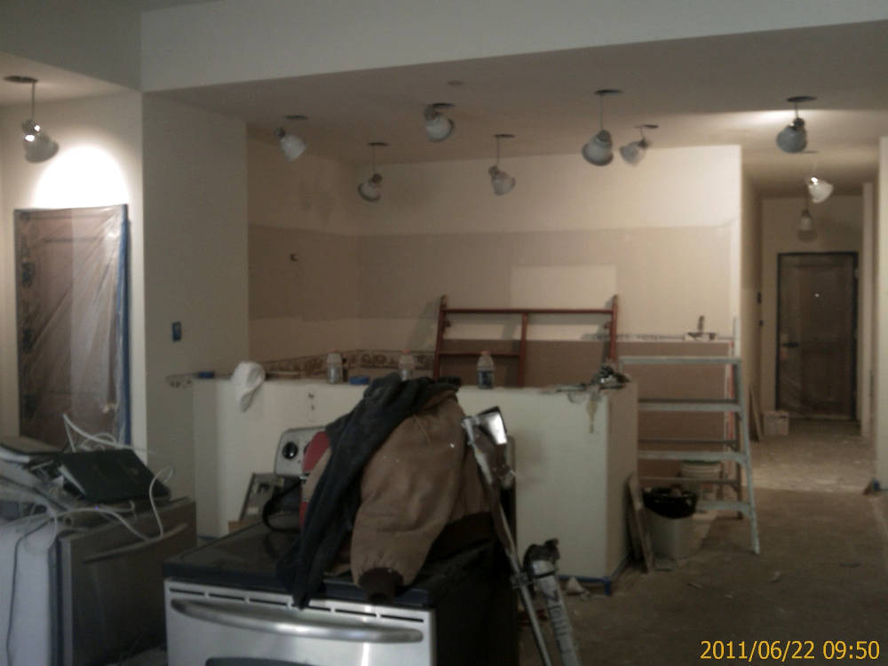 a condominium remodel, texture change from drywall
texture knock down to skip trowel / hand texture the owners installed new lights