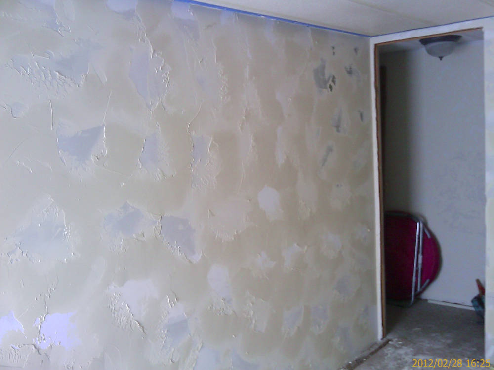 after the drywall texture is
done using a skip trowel / hand texture and is ready to paint.