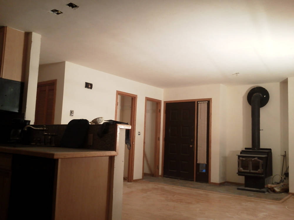 showing a leaving room with a skip trowel / hand texture ready to prime and paint.