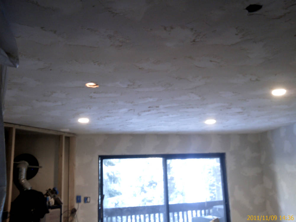 showing re-texturing using skip trowel / hand
texture and is ready to paint.