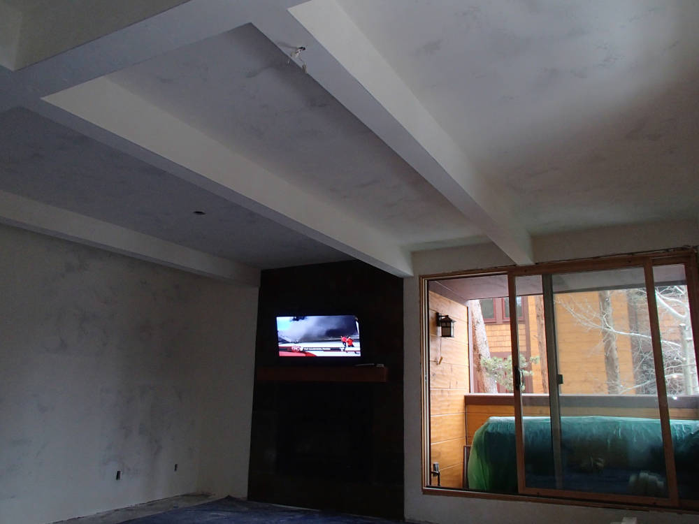 A ceiling after the Quietrock drywall installation, tape and texture is done.