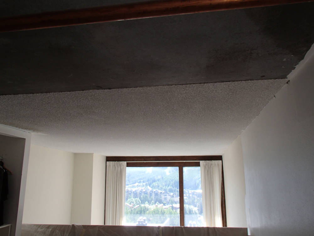showing a condominium where the popcorn ceiling is been covered