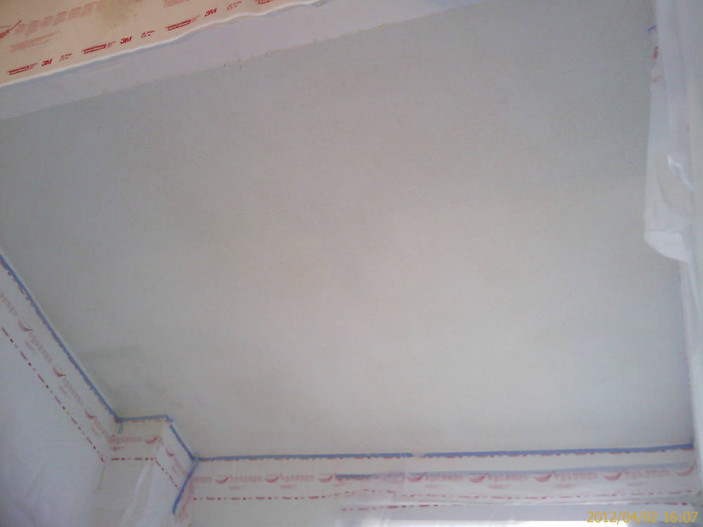 showing a ceiling after the orange peel drywall texture
					is done.