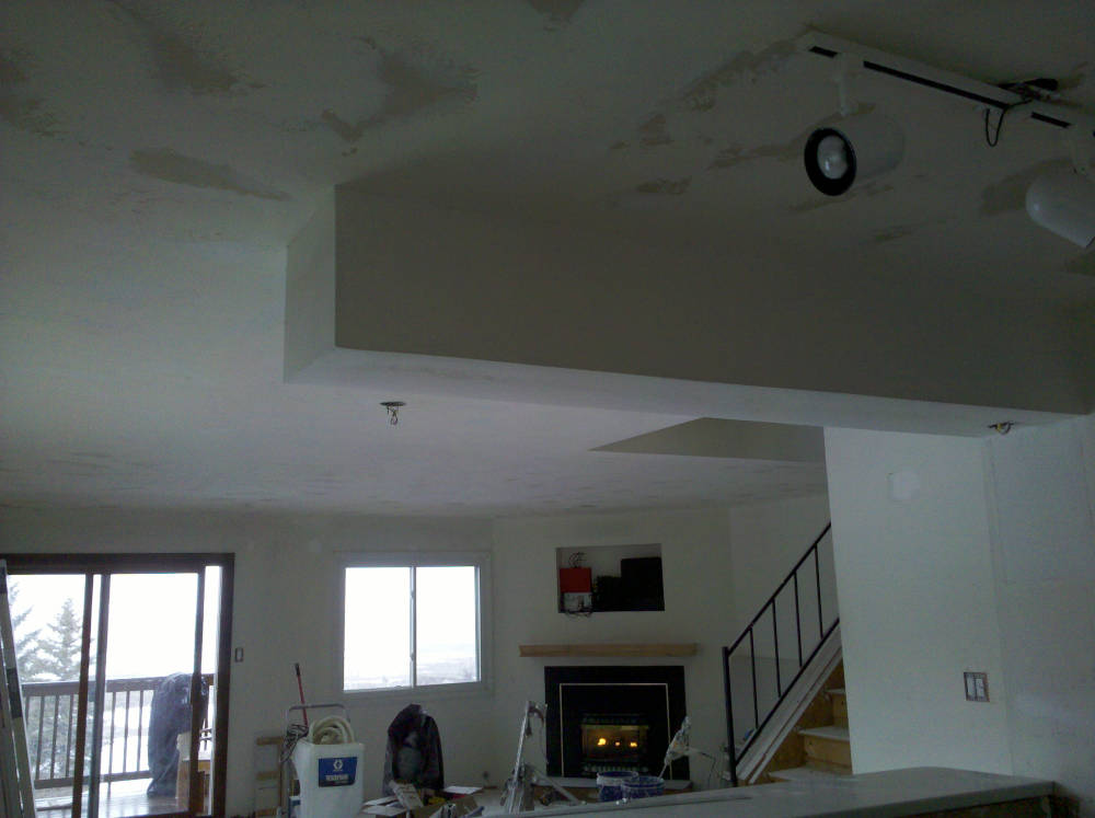 showing the ceiling after its been textured using a skip trowel drywall texture ready to paint.