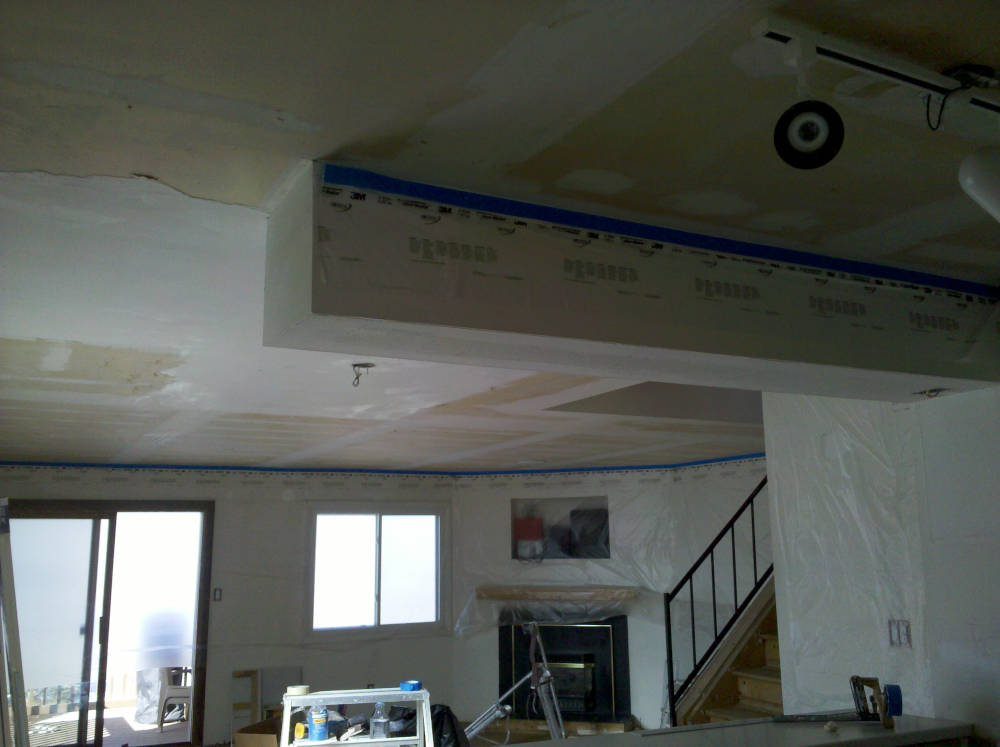 showing a ceiling after the popcorn ceiling have been removed.