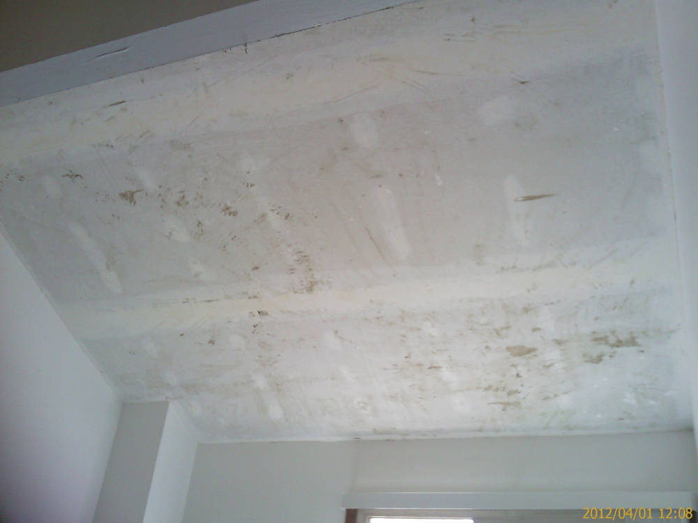 showing a catedral ceiling after the acoustical ceiling
removal is done.