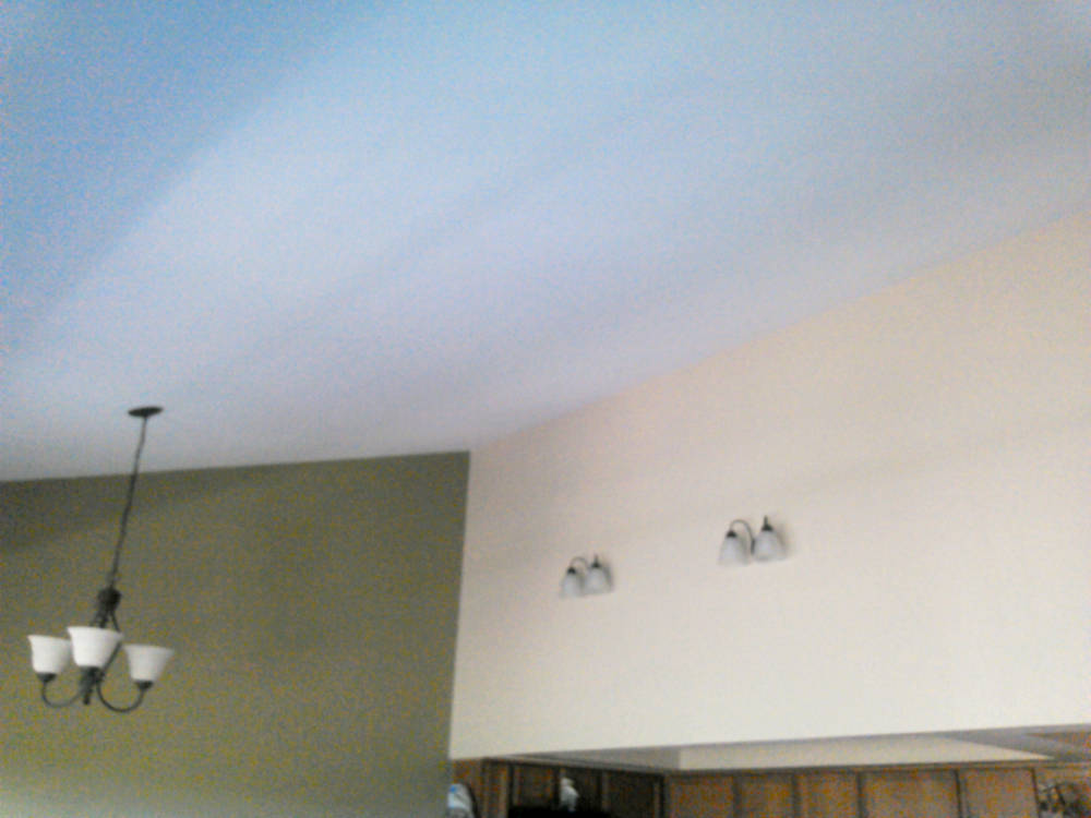 showing a condominium after the Skim Coat, New Texture, Primer and Pain are done looking like new.