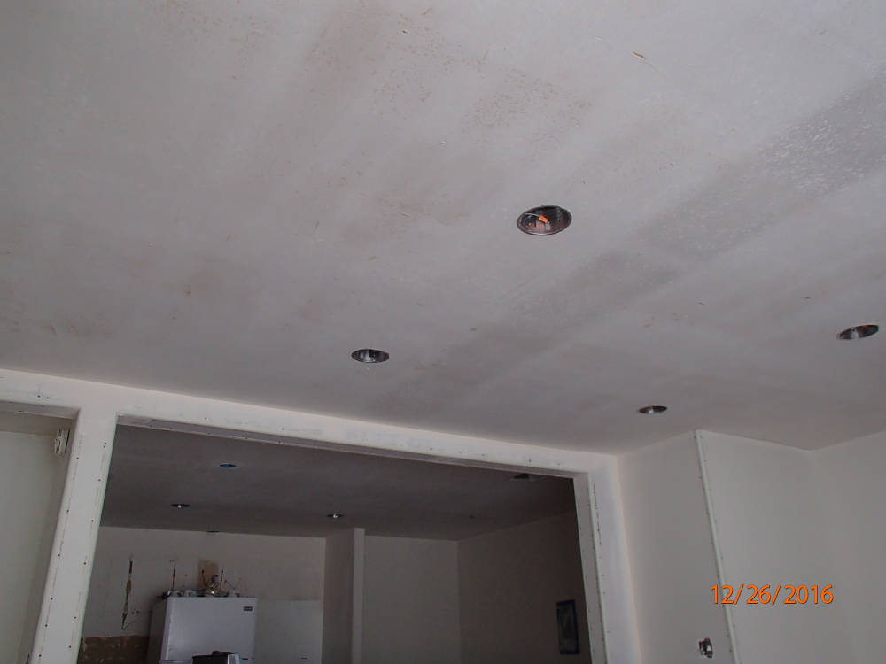 showing a ceiling after the popcorn ceiling have been removed