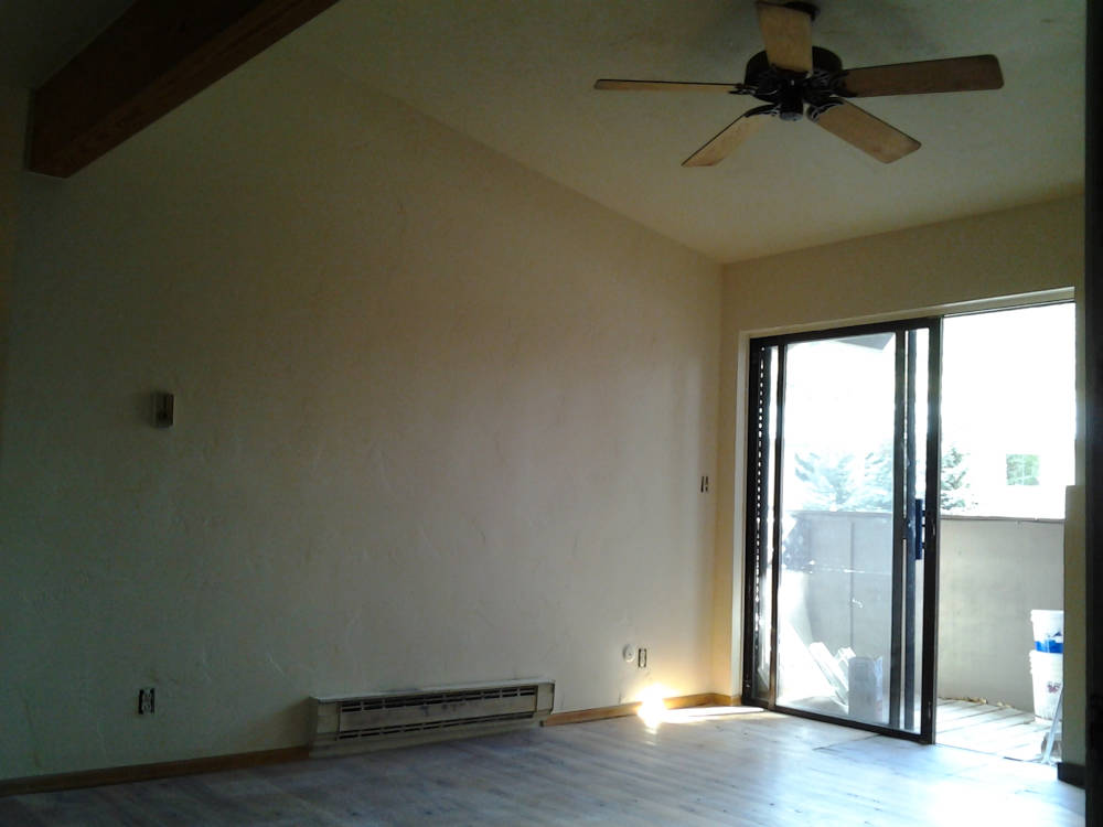 a wall where the mirror was replaced with drywall, the popcorn texture is gone and is
showing a fresh coat of paint.