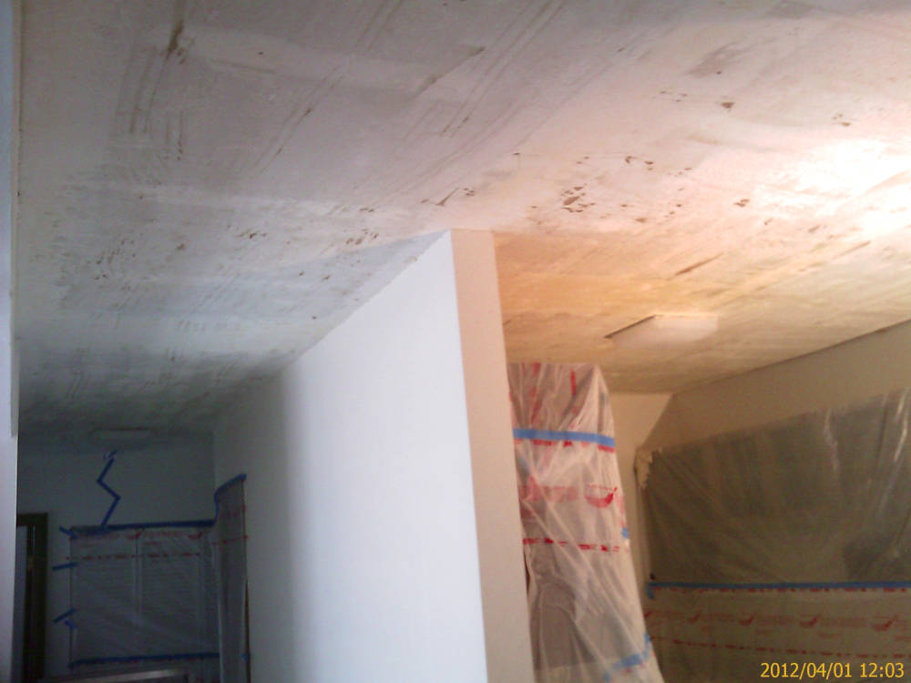 a remodel, a kitchen after the popcorn ceiling removal is done.
