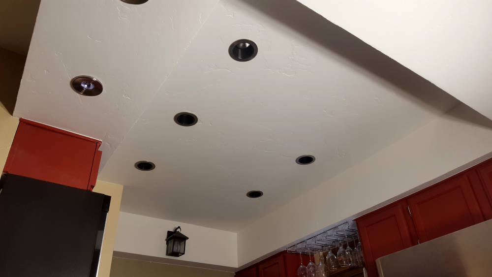 kitchen ceiling with a brand new skip trowel texture, primed and painted.