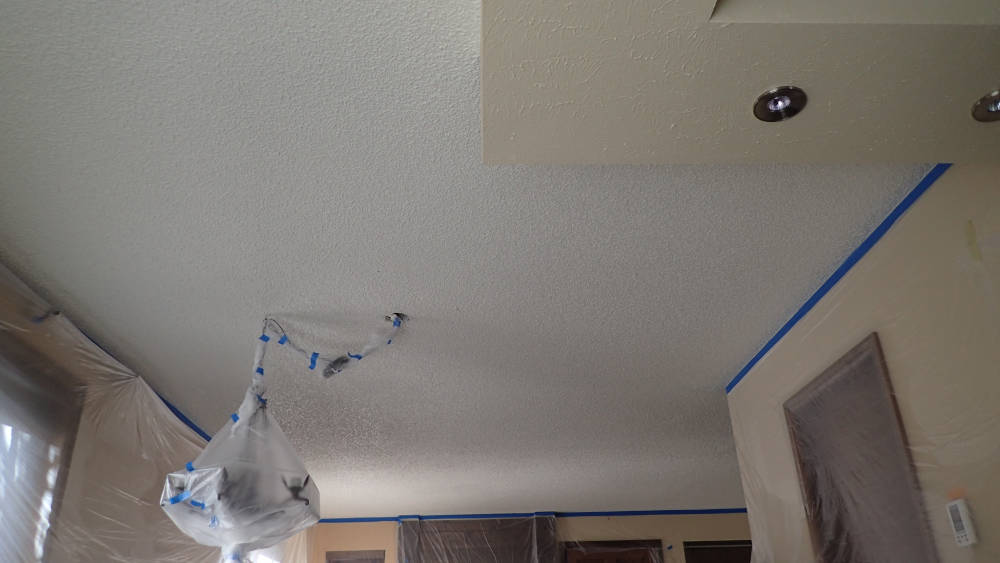 leaving room completly protected with plastic ready for popcorn removal