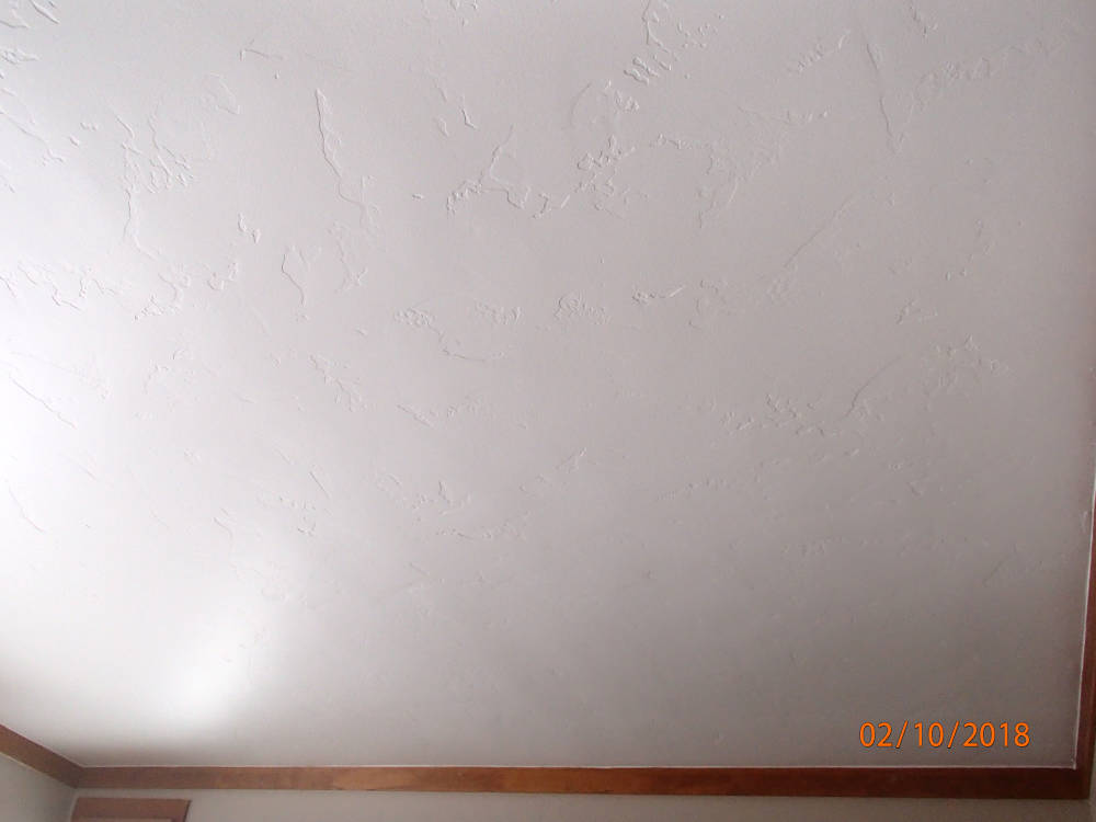 a ceiling with the Skip Trowel / Hand drywall texture.