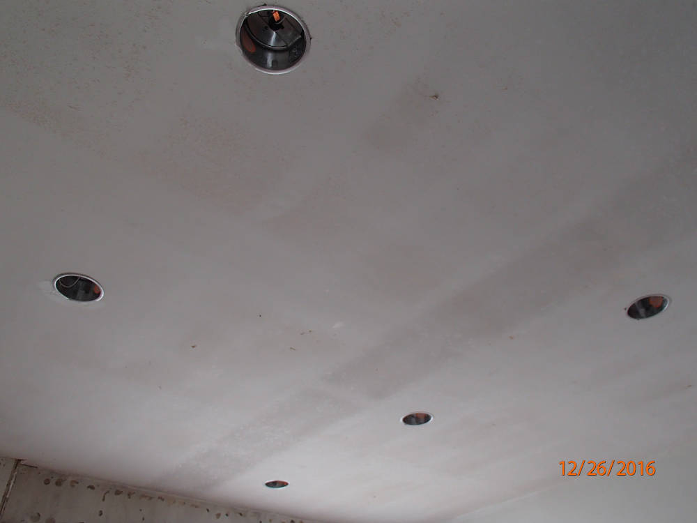 showing a ceiling after the popcorn ceiling have been removed