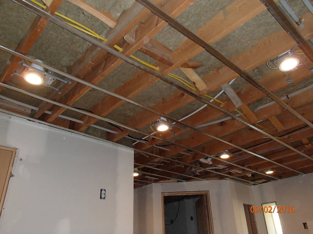 Ceiling after drywall installation, tape and texture is done.