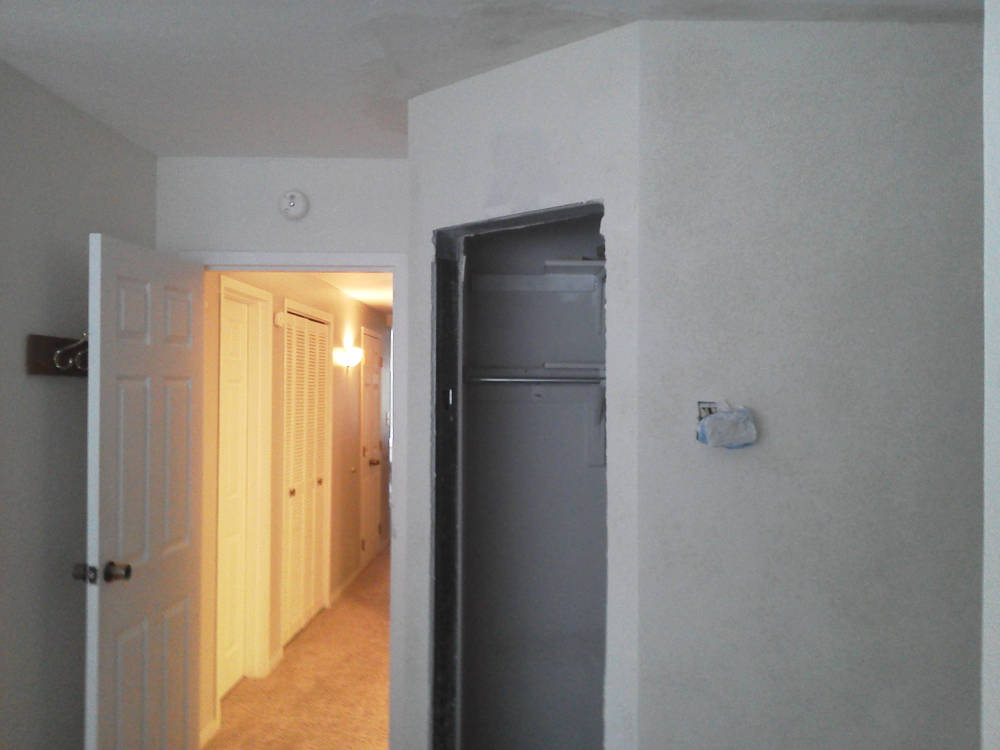 after the drywall installation, tape and texture is done in a closet with steel stud framing.