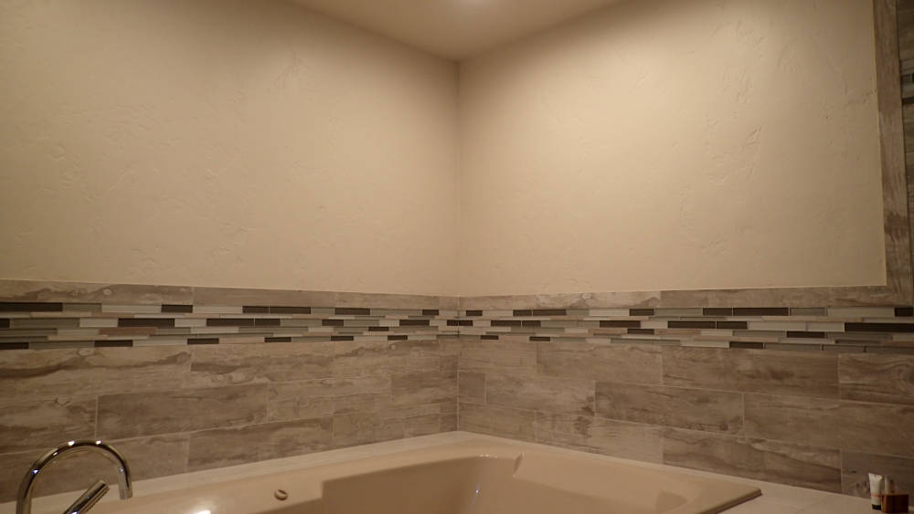 Bathroom jacuzzi in Vail, Colorado. after walls and ceiling were re-textured to the most popular drywall texture the skip trowel drywall texture.